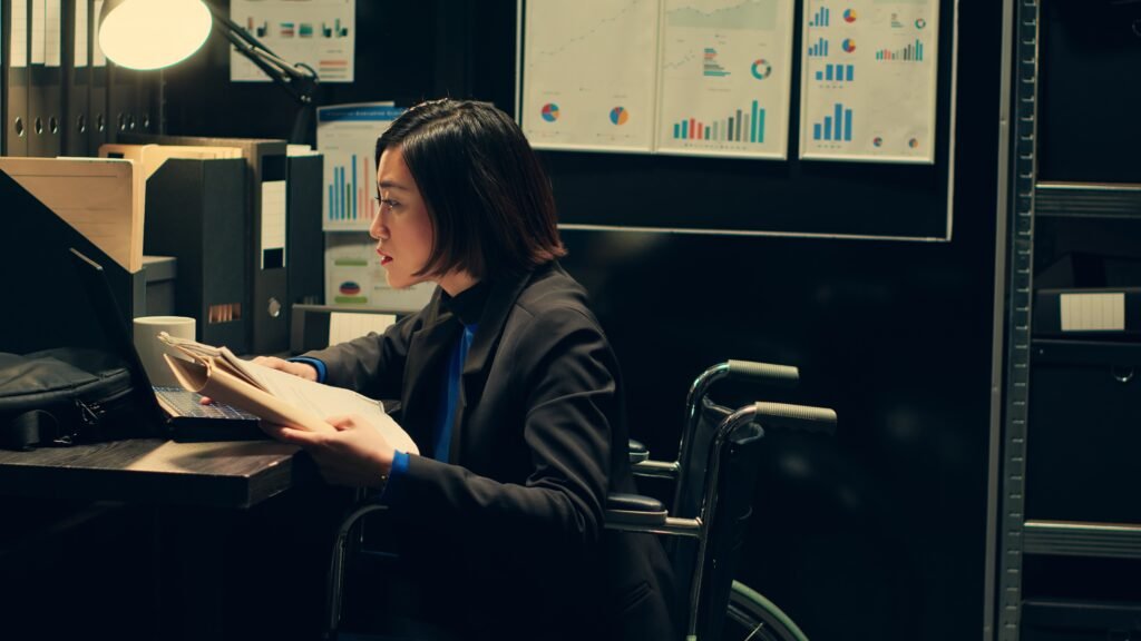 Detective in wheelchair accessing correspondence for investigative purposes โปรแกรมบัญชีโรงแรม Night Auditor คืออะไร